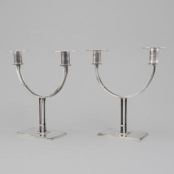 A pair of Klas-Göran Tinbäck two light sterling silver candelabra. Stockholm, 1989.
