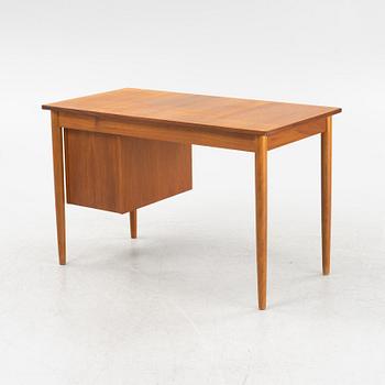 A teak veneered desk, 1950's/60's.