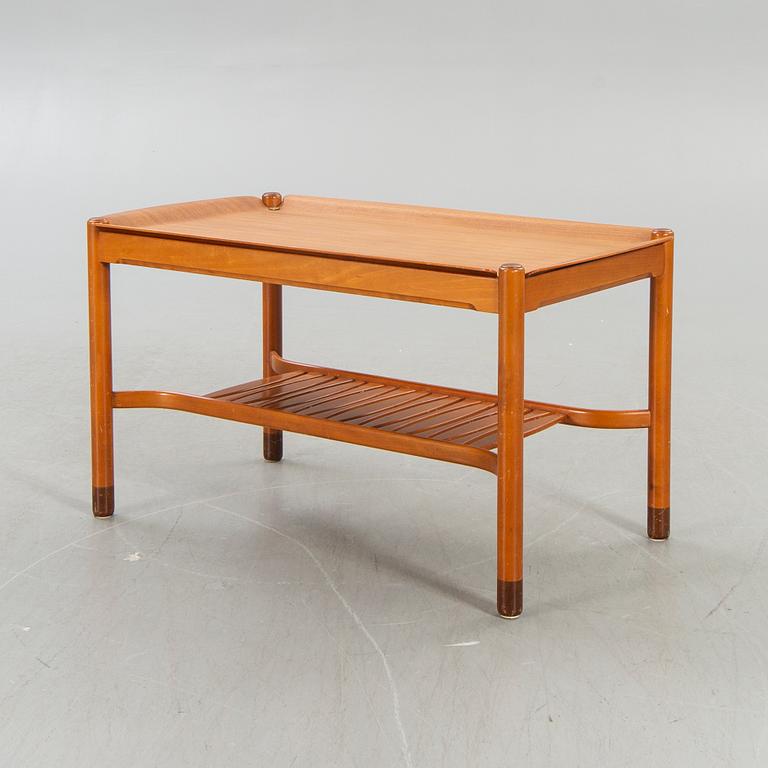 An NK  1950/60s teak coffee table.