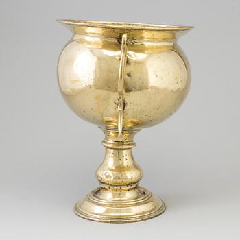 A 19th century brass champagne cooler.