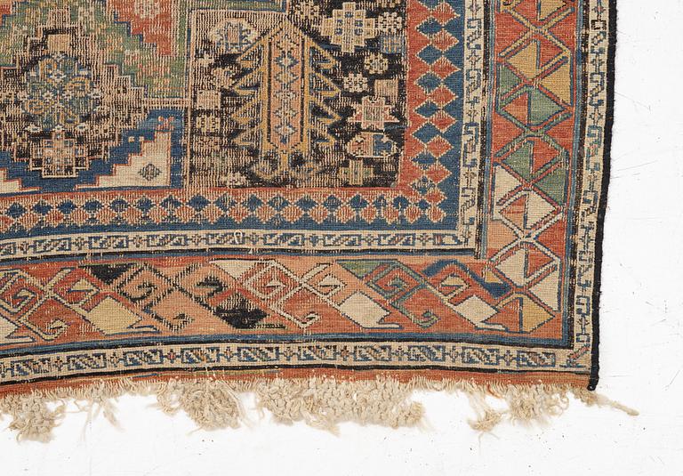 An oriental carpet, c 280 x 130 cm.