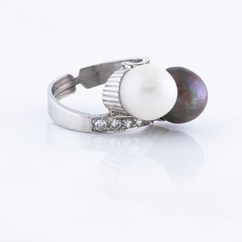 A cultured pearl and single cut diamond ring.