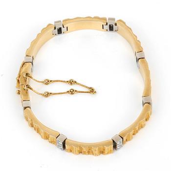 ARMBAND, 18K guld, 16 diamanter, Lapponia, 1984. Vikt ca 30g.