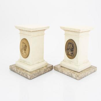 A pair of modern plaster statues of Napoleon.
