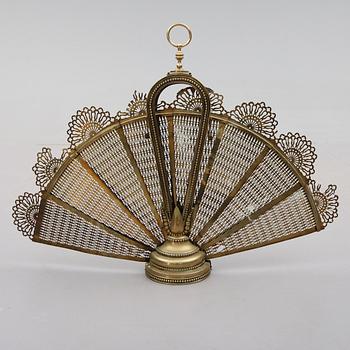 BRASSKYDD, mässing, 1900-talets första hälft.