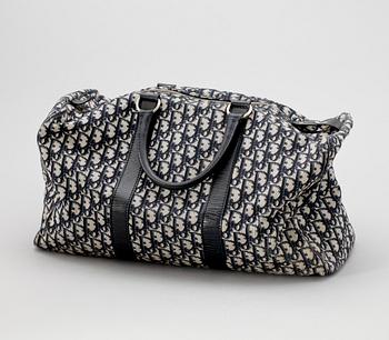 A blue monogram canvas weekendbag by Christian Dior.