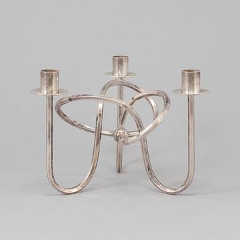 Josef Frank, a silver platen "Vänskapsknuten" candelabra ju Josef Frank för Firma Svenskt Tenn.