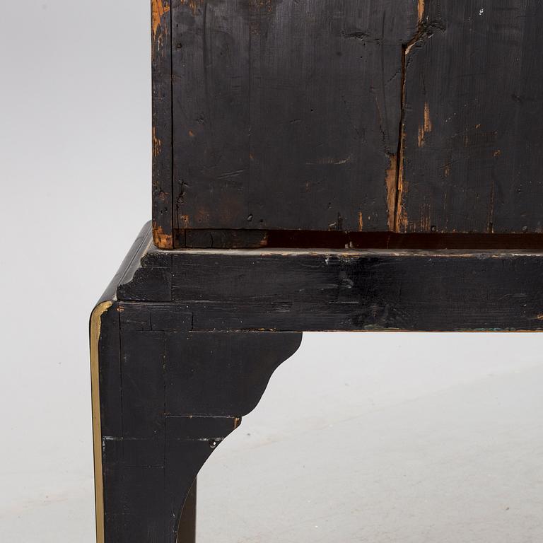 AN early 18TH CENTURY PROBABLY ENGLISH Japanned laquer cabinet on stand.