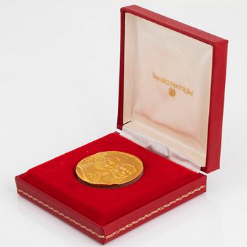 A Swedish commemorative medal in 18K gold.