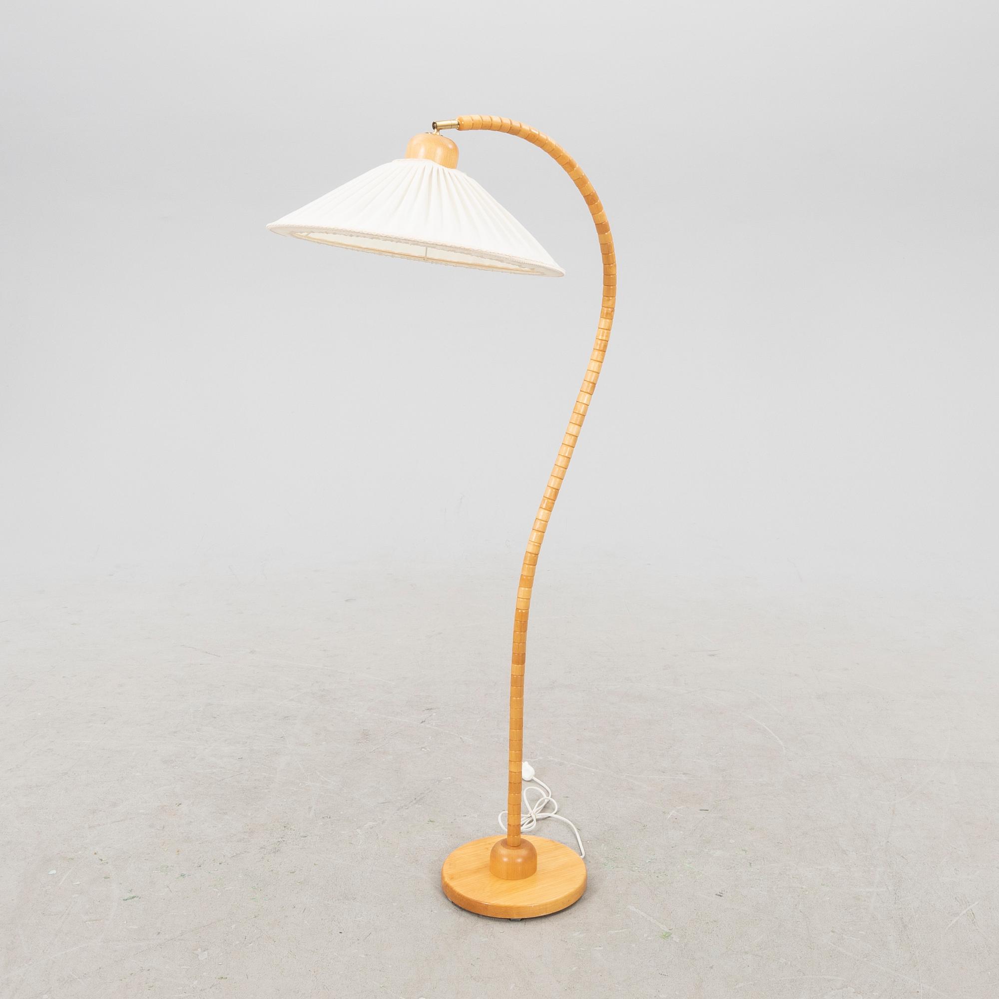 A Markslöjd 21st century wooden floor lamp.