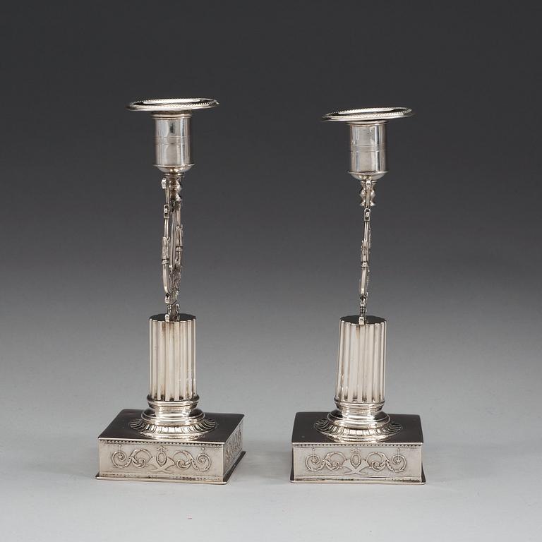 A pair of Swedish 19th century silver candlesticks, makers mark of Johan Petter Grönvall, Stockholm 1823.