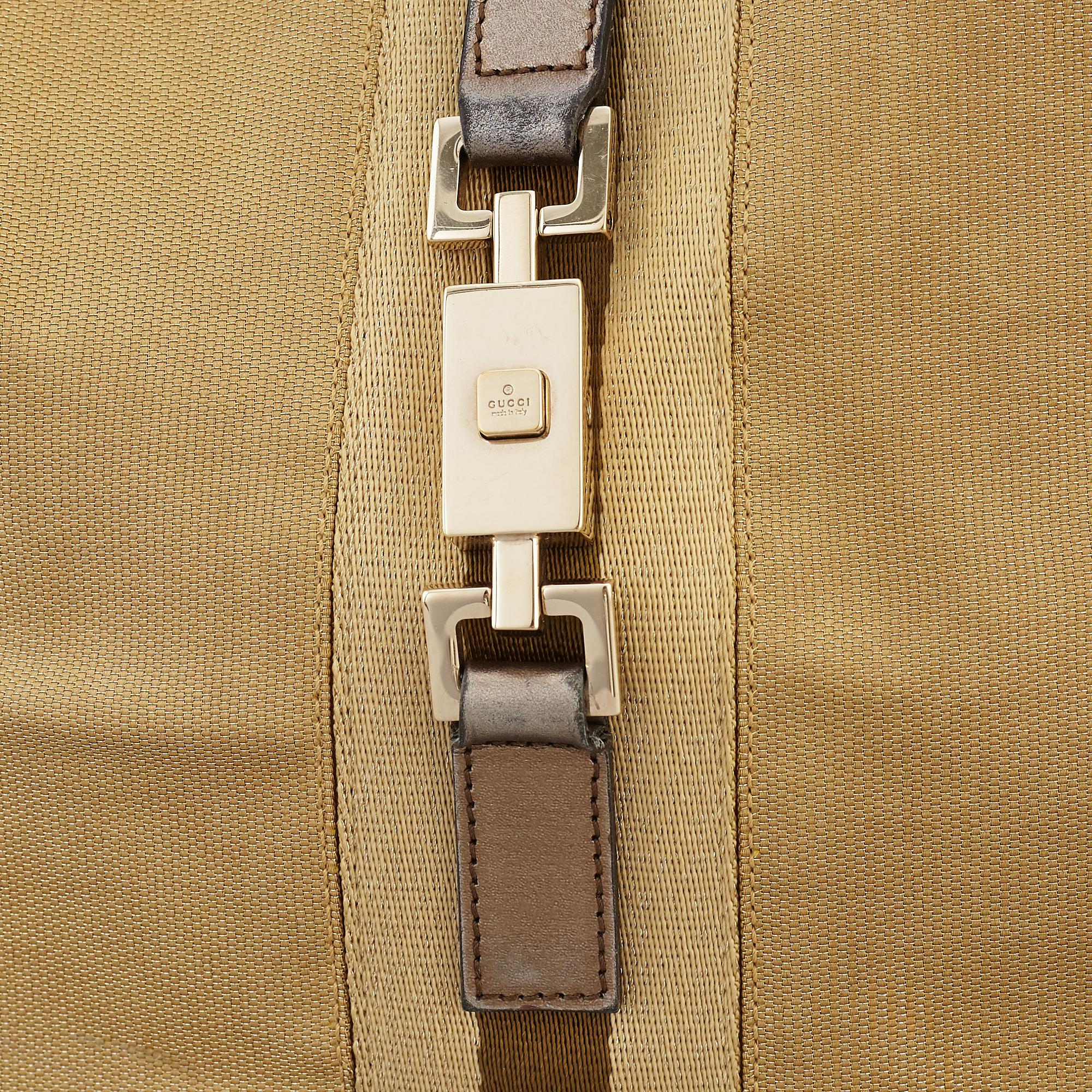 GUCCI, a metallic bag.