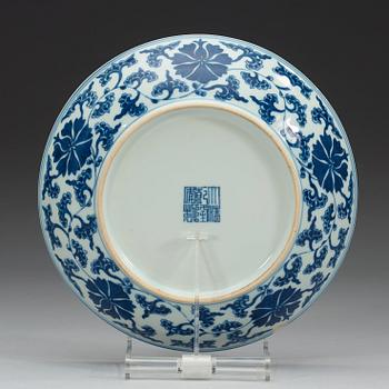 A set of four blue and white lotus dishes, Qing dyanasty with Qianlong sealmark.