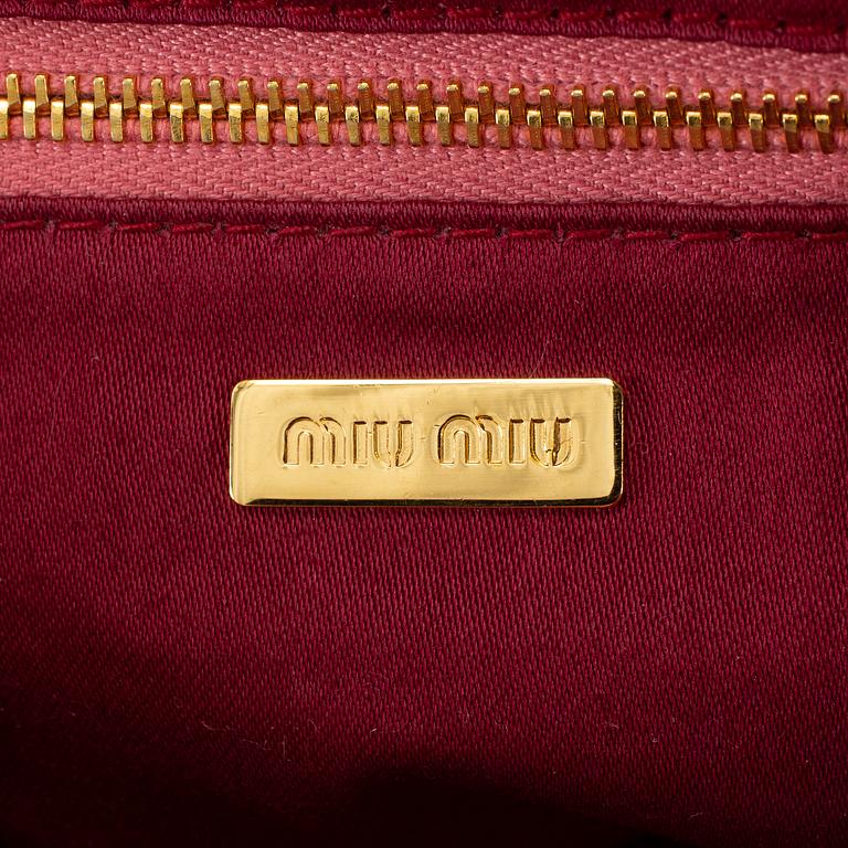 MIU MIU, a pink leather bag.