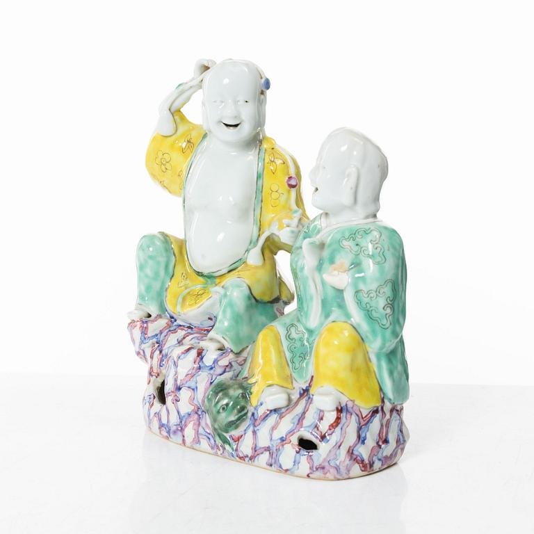 A Chinese porcelain figure group 'happy boys', Qing dynasty, 18th century.