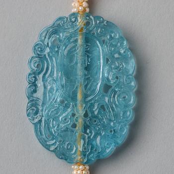 A Chinese sculptured aquamarine pendant.