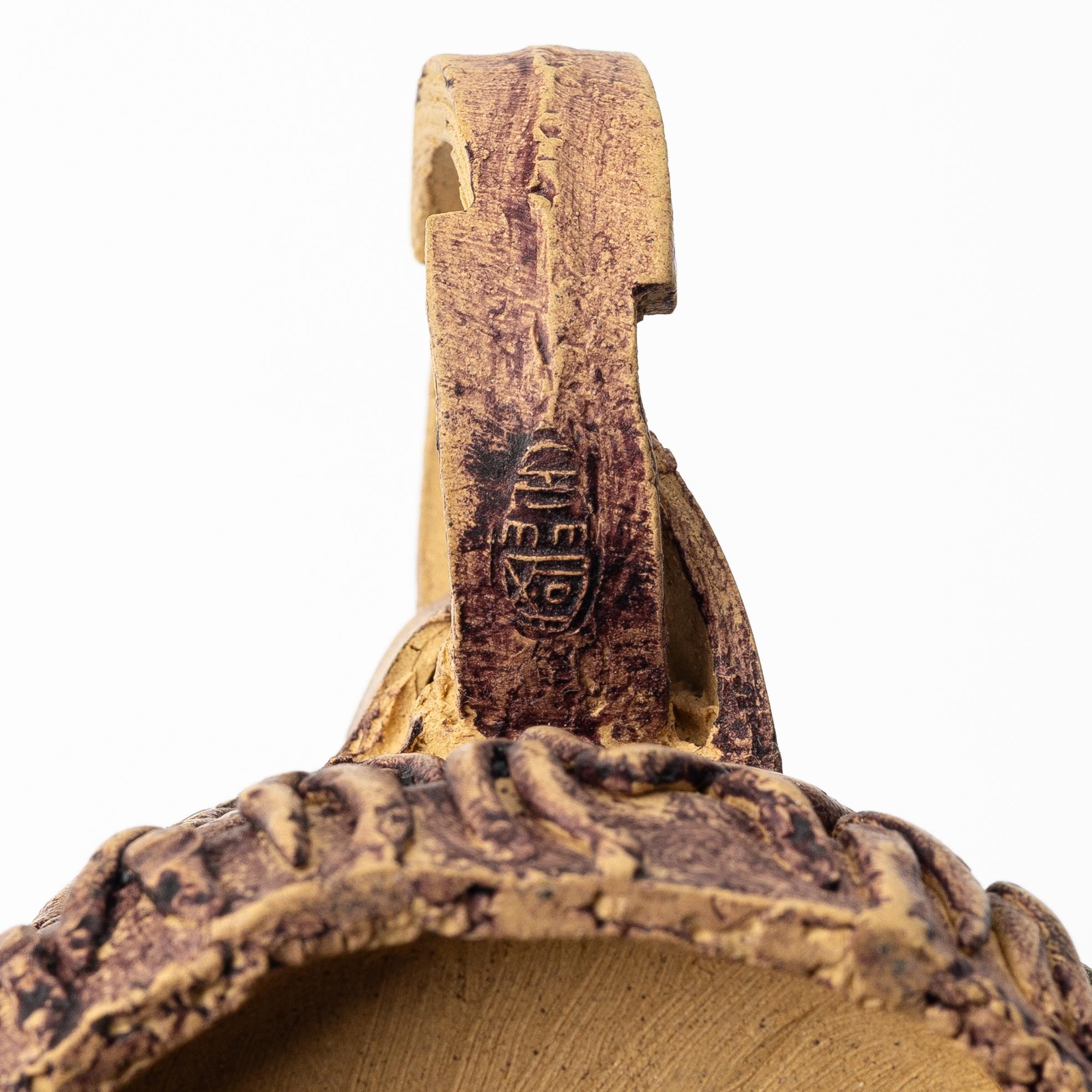 A group of three bright yellow yixing 'Gongfu' teapots, China, 1990s.