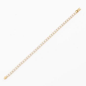 Tennis bracelet in 18K gold with brilliant-cut diamonds.