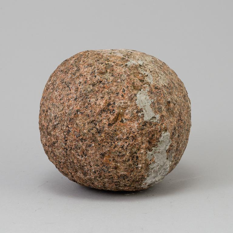 A GRANITE CANNON BALL, possibly 18th century.