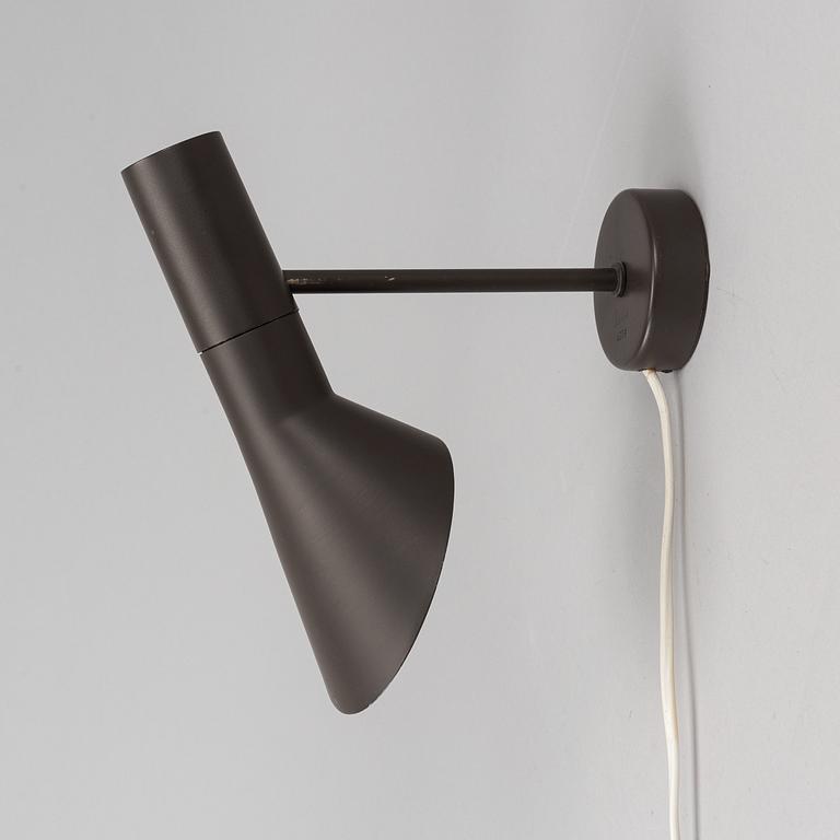 Arne Jacobsen, a black lacquered 1950/60's wall light by Axel Annell on license from Louis Poulsen.