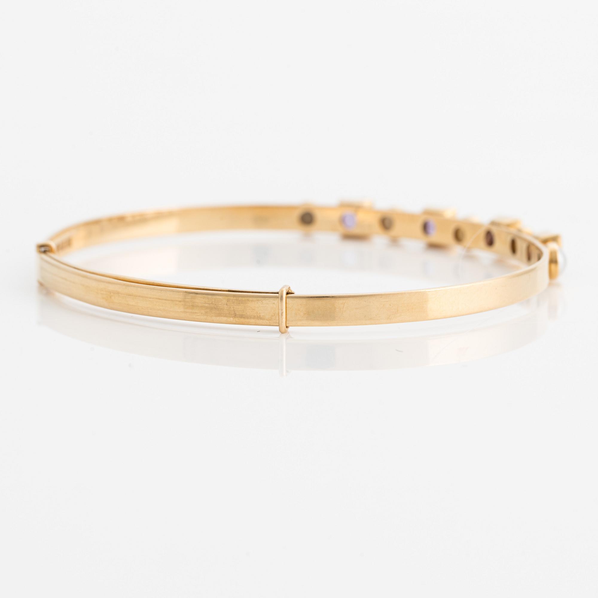 Armring, 18K guld med pärlor och ametister. Stockholm 1964.