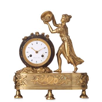 86. A French Empire early 19th century mantel clock.