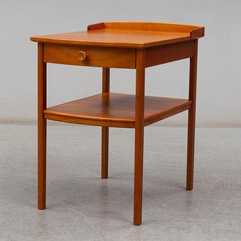 A Carl Malmsten head boards and bedside table, late 20th century.