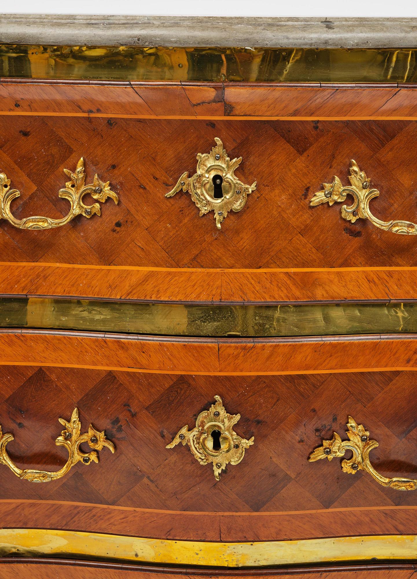 A rococo parquetry commode by C. Linning (master in Stockholm 1744-79).