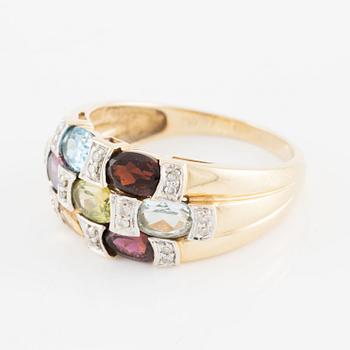 Ring, 18K gold with an oval-cut topaz, garnet, amethyst, peridot, aquamarine, as well as citrine and octagonal-cut diamonds.