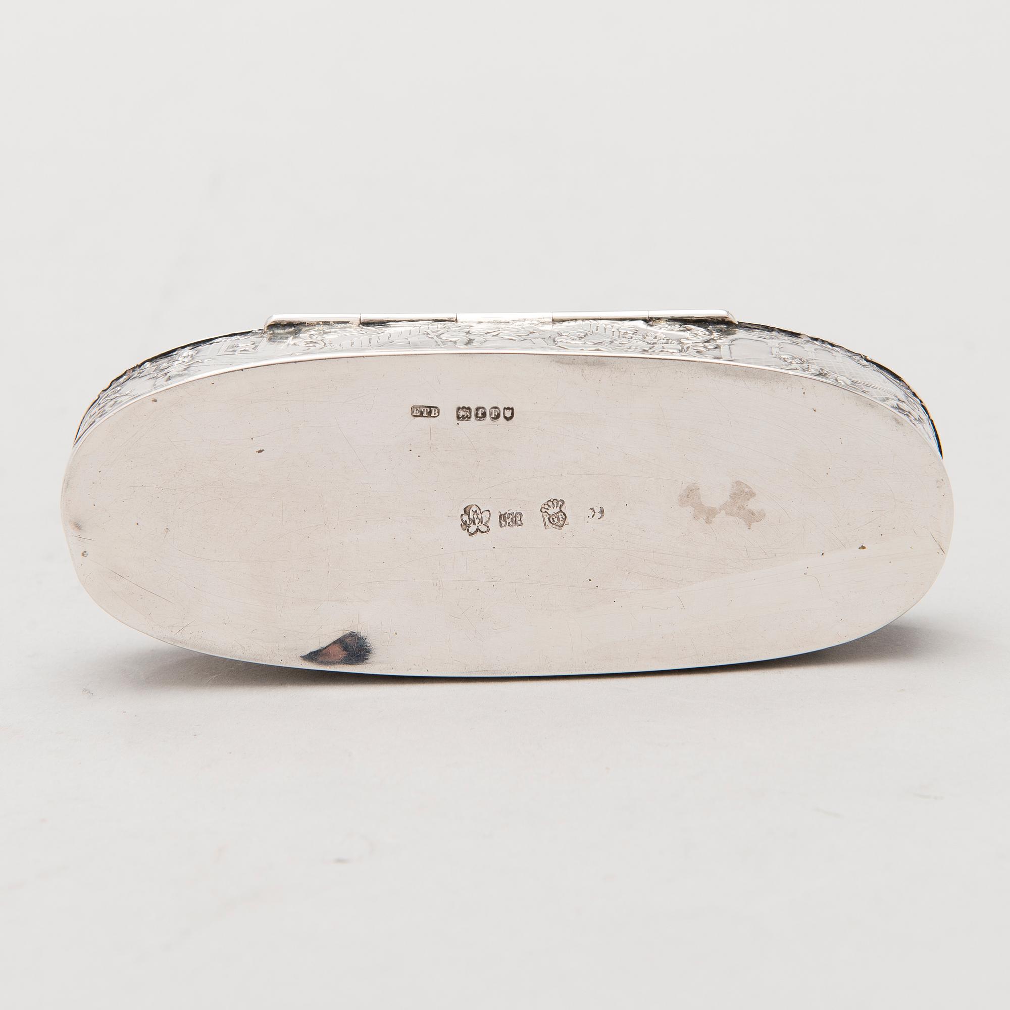 Four silver objects from the 20th Century.
