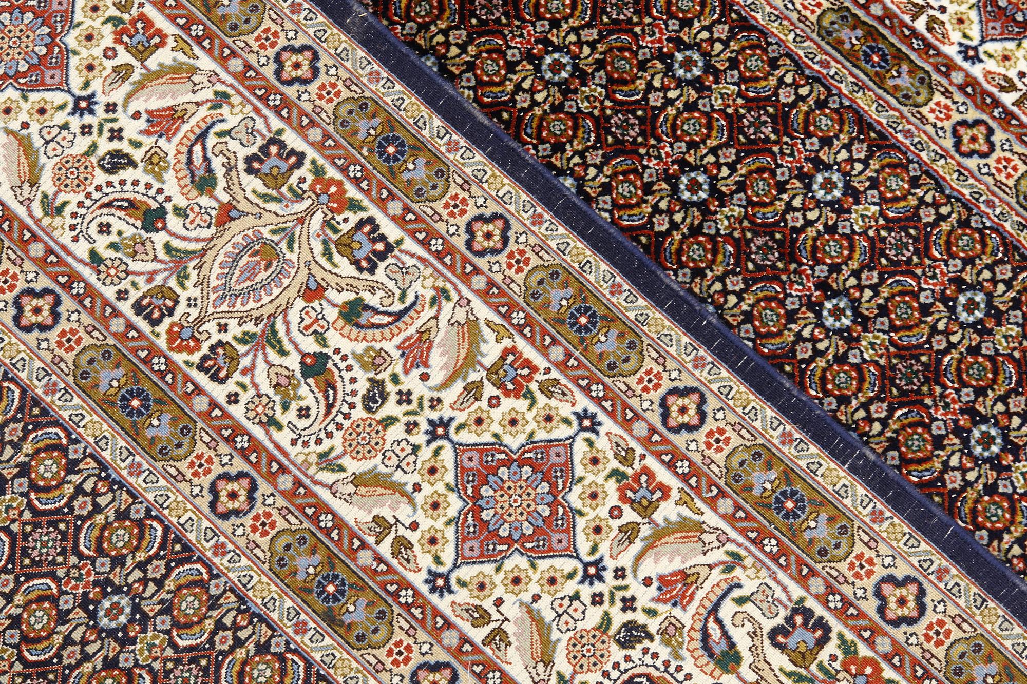A Moud part silk carpet, signed, 335 x 250 cm.