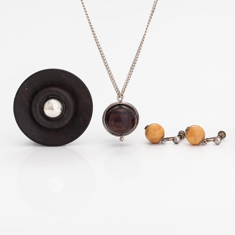 Kaija Aarikka, A necklace, a paid of earrings and a brooch made of silver and wood. Finland.