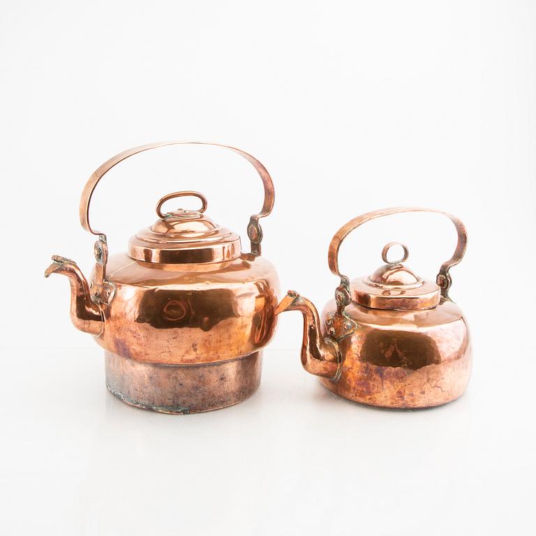 A pair of 19th century copper coffee pots.