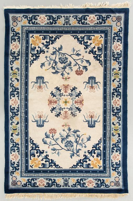 An old Chinese carpet ca 187 x 127 cm.