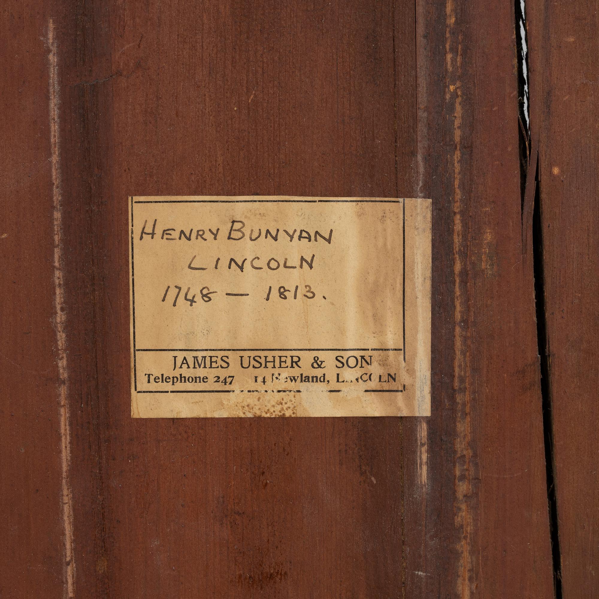 A mahognay long case clock from around the year 1800, H Bunyan Lincoln.