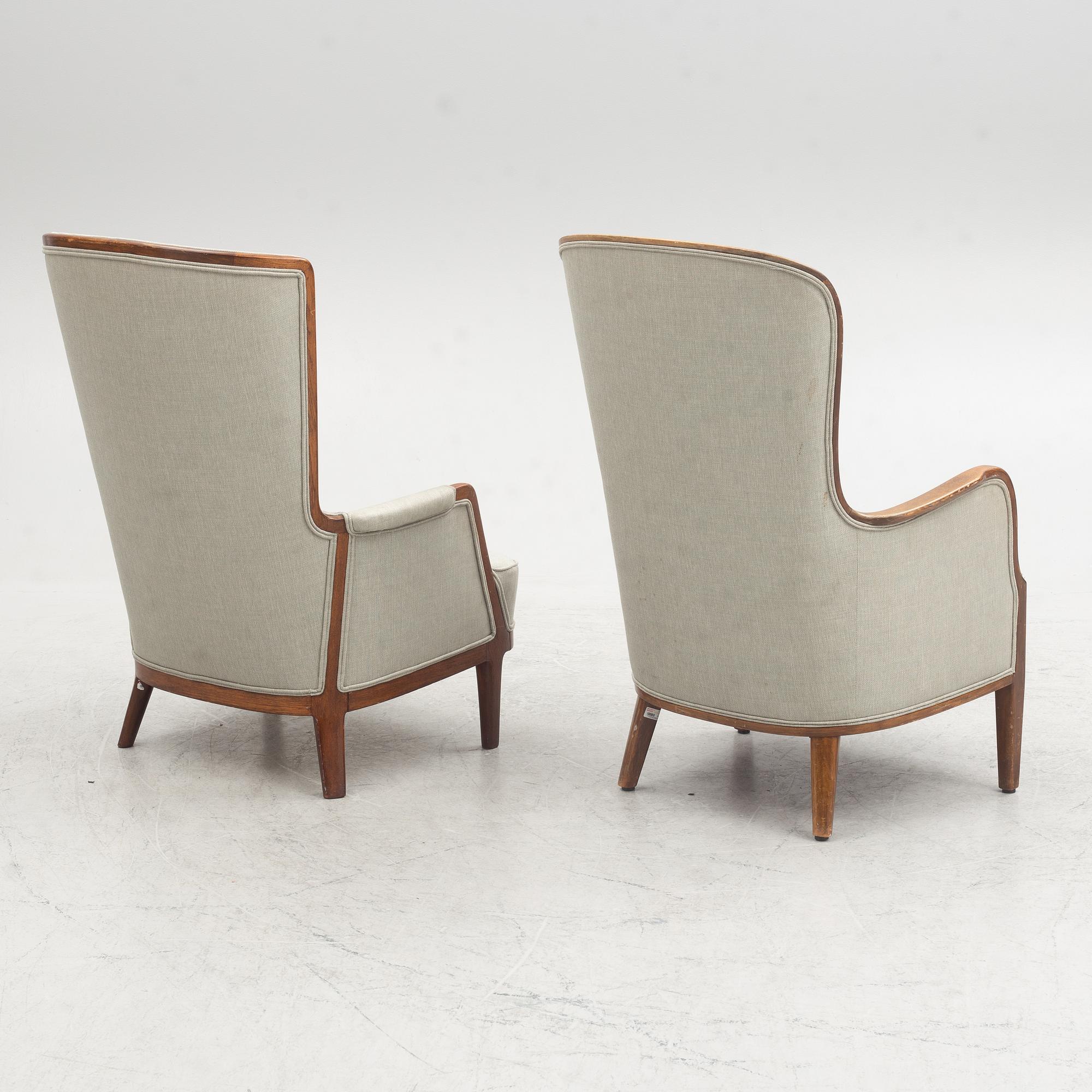 A pair of similar Swedish Modern armchairs, mid 20th century.