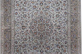A carpet, Kashan, signed Fani, ca 420 x 300 cm.
