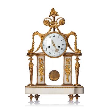 113. A Louis XVI gilt bronze and white marble mantel clock, late 18th century.