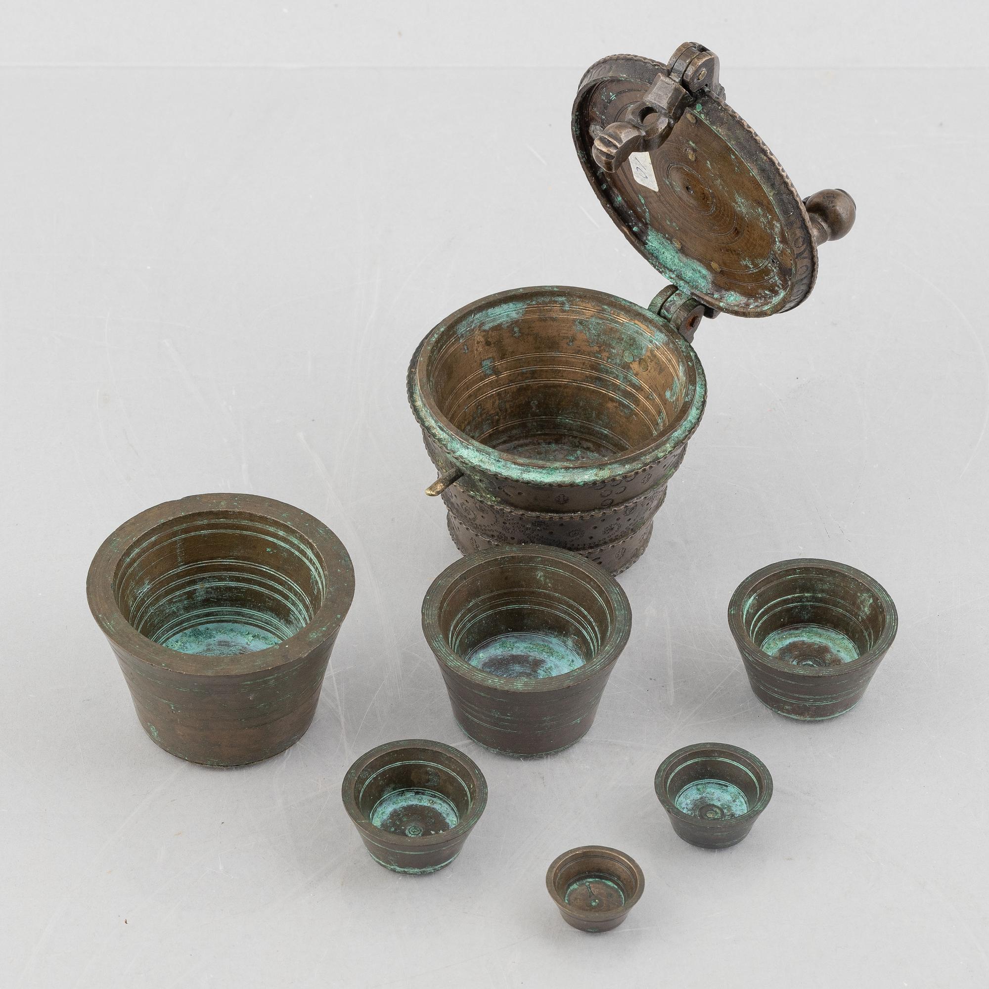 A set of three Nuremberg brass nested cup weights, one by Christoph or Johan Conrad Schön (masters 1746(1750).