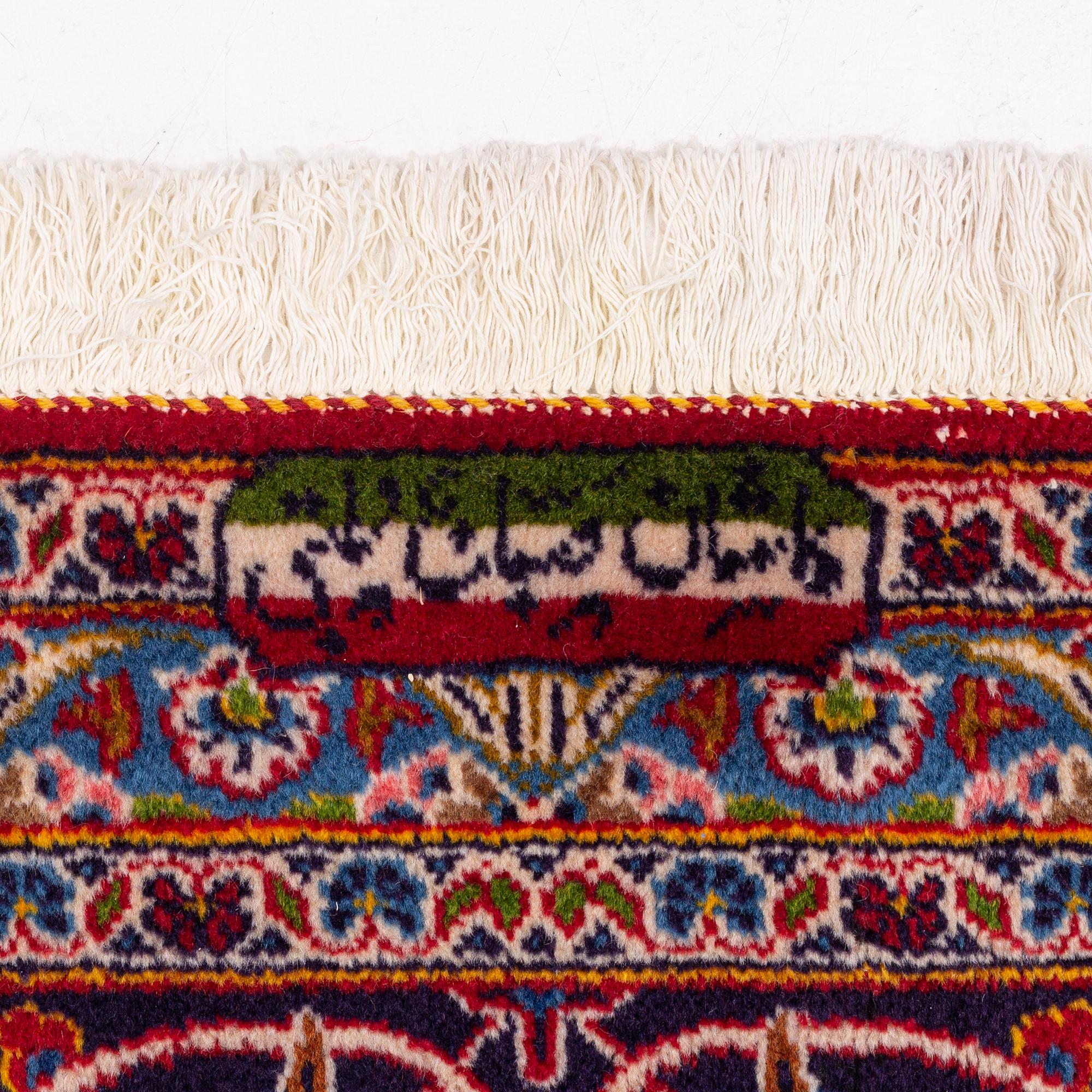 A Kashan carpet signed, approx. 420 x 292 cm.