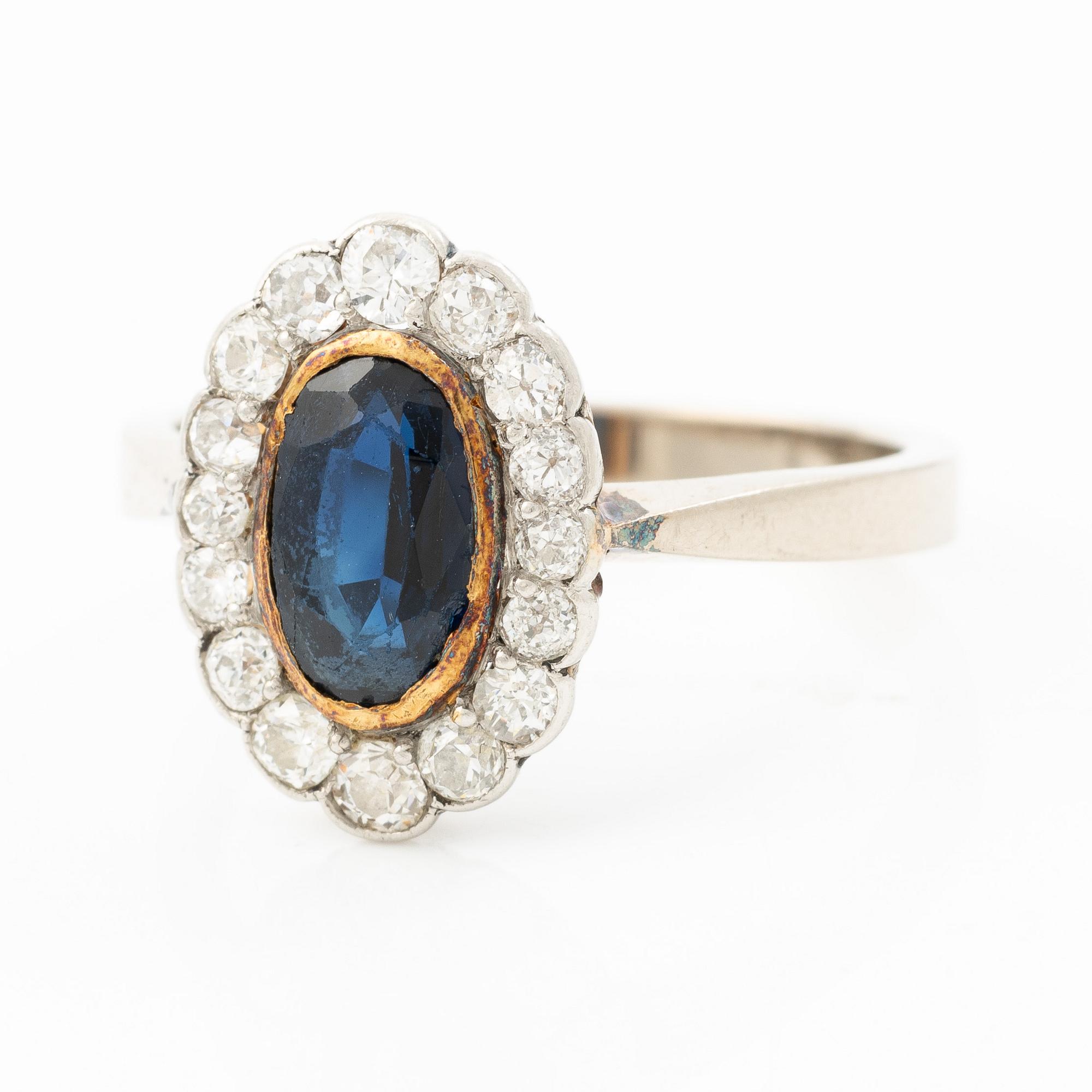 Ring, camrose model, 18K white gold with sapphire and old-cut diamonds.