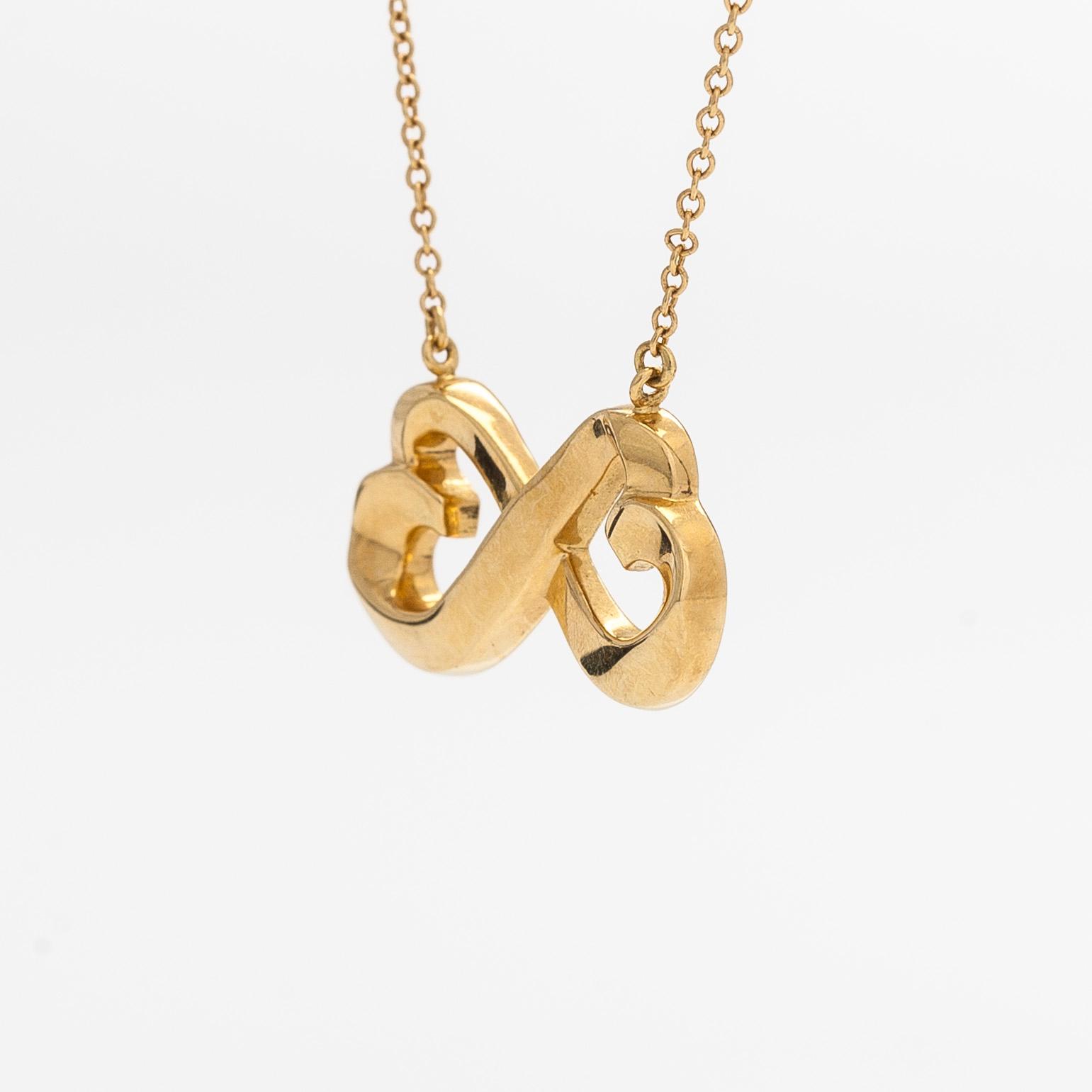 Tiffany & Co, Paloma Picasso, a "Double Loving Heart" necklace in 18K gold.