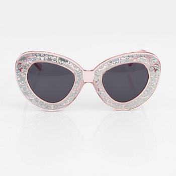 Karen Walker, a pair of pink "Intergalactic" sunglasses.