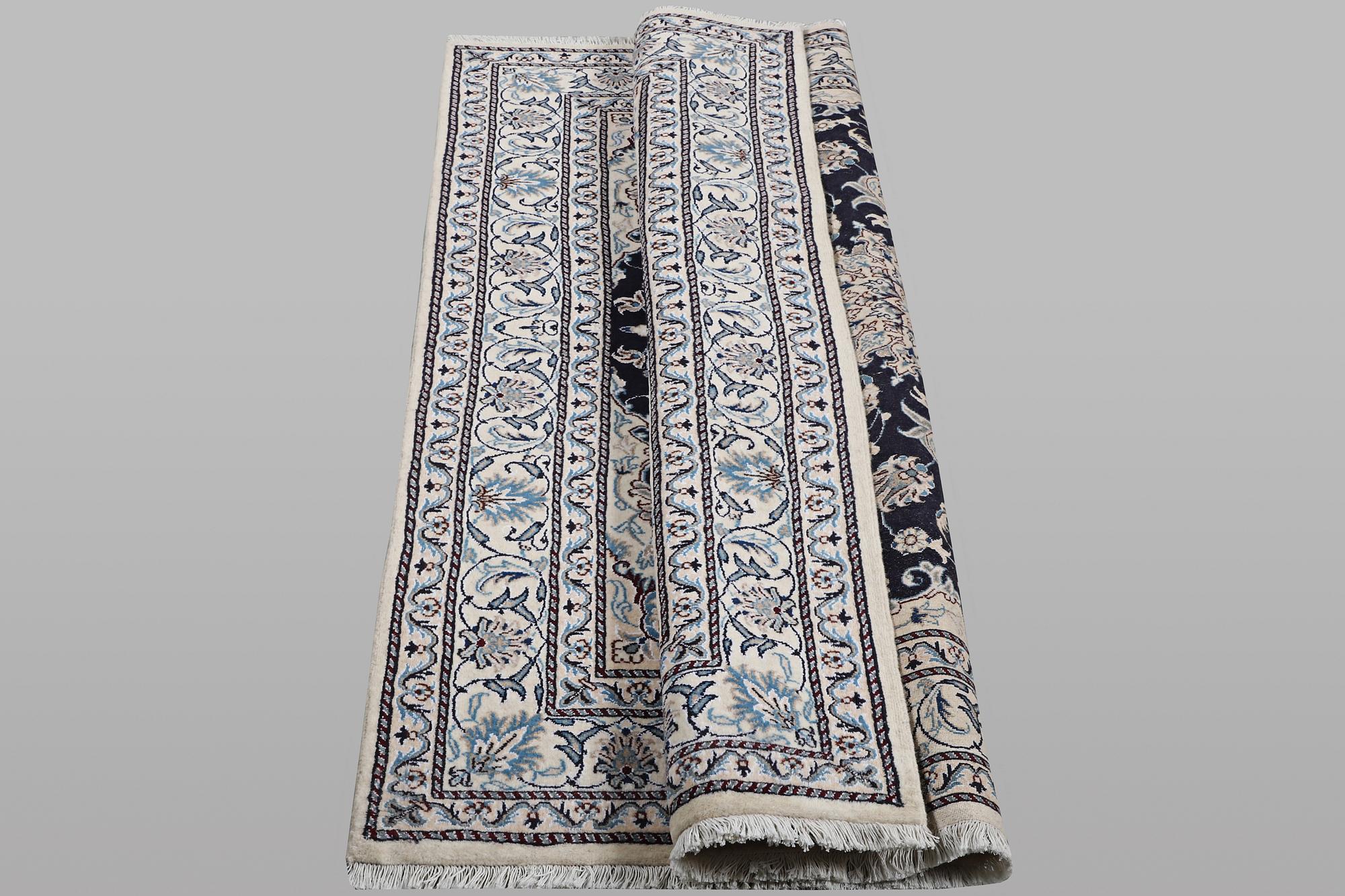 A rug, Nain, part silk, ca 198 x 144 cm.