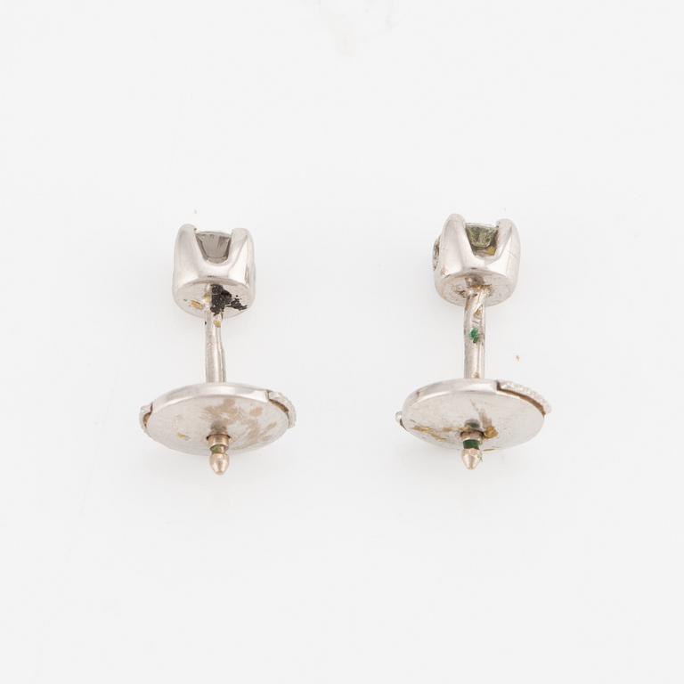 A pair of earrings in 18K white gold with round brilliant-cut diamonds.