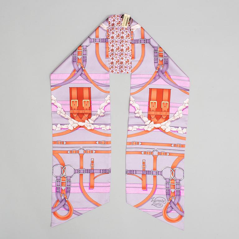 Hermès, a Maxi Twilly, 'Grand Manège' silk scarf.