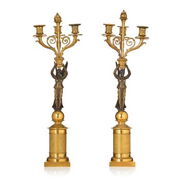 146. A pair of Empire ormolu three-light candelabra, early 19th century.