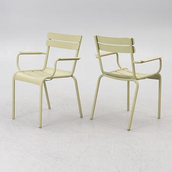 Frédéric Sofia, a table and two chairs for outdoor use, "Luxembourg" Fermob, France, 21st century.