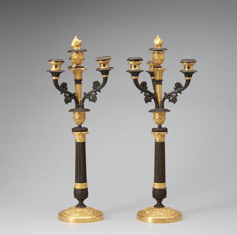 A pair of French Empire 19th century four-light candelabra.