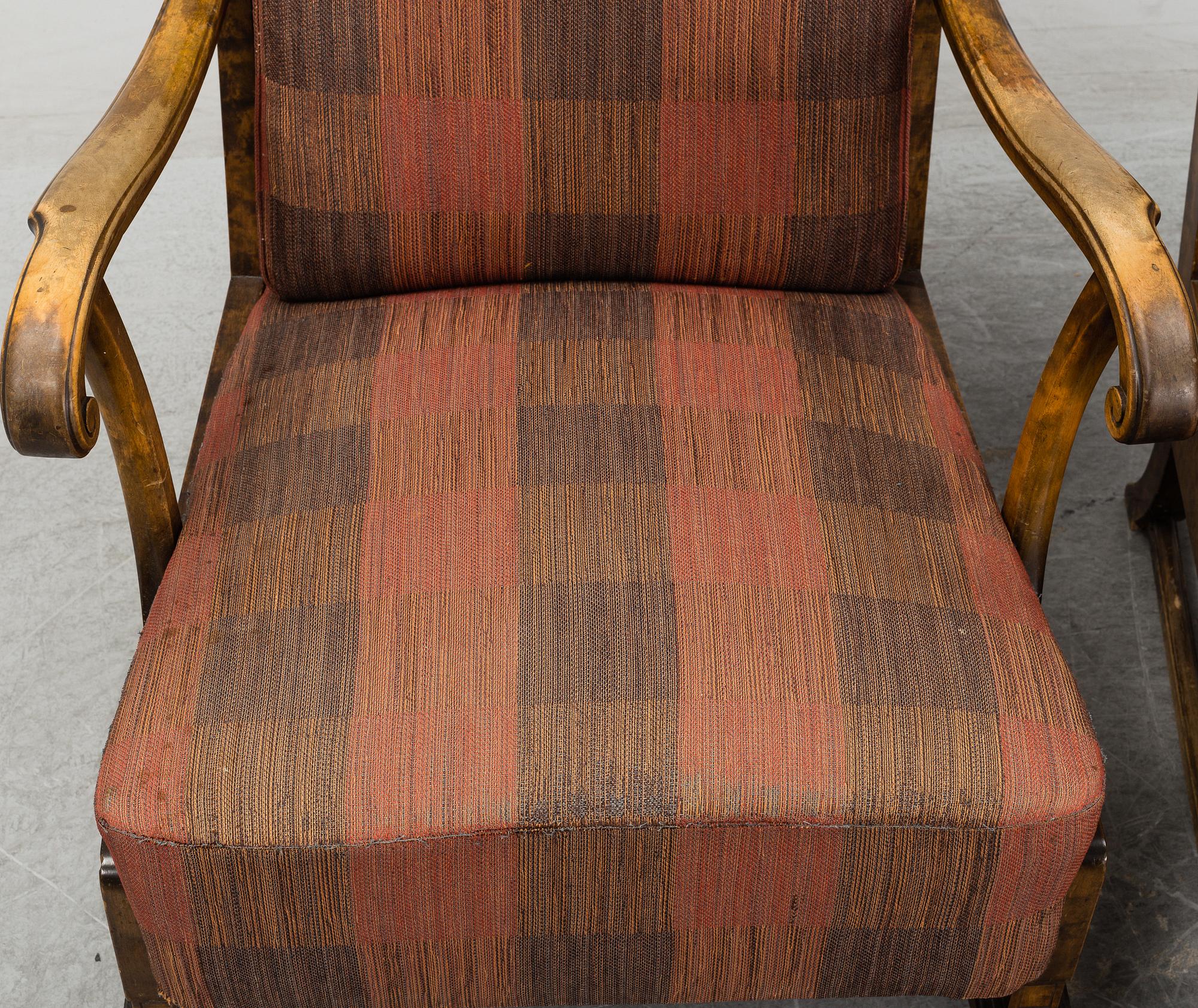 A pair of 1920s easy chairs.